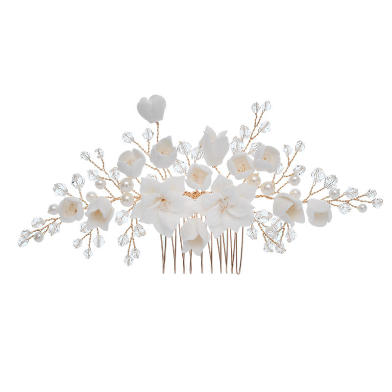 White floral bridal hair comb with pearl and crystal branch embellishments