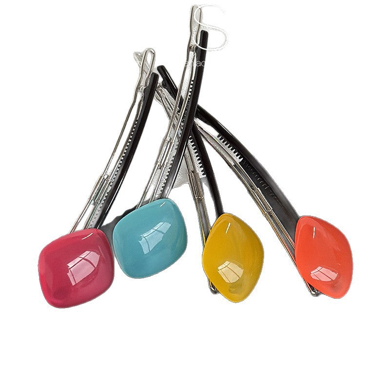 Close-up view of the acrylic hair clip shape and clasp