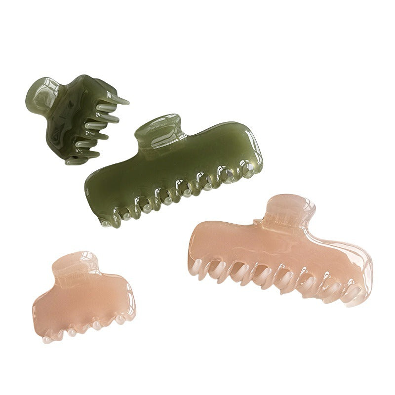 Pink and green glossy cellulose acetate claw clips shown from multiple angles