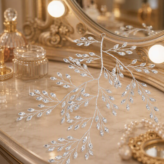 Branching rhinestone leaf hair vine displayed against an ornate vanity