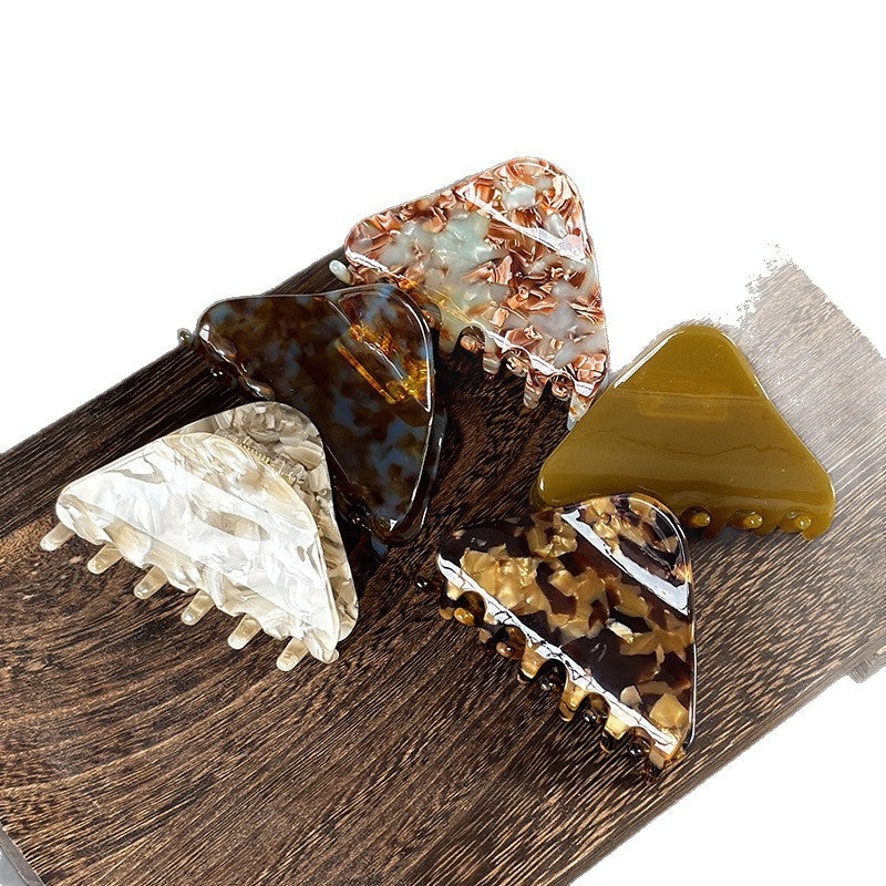 Close-up view of a patterned acetate claw hair accessory