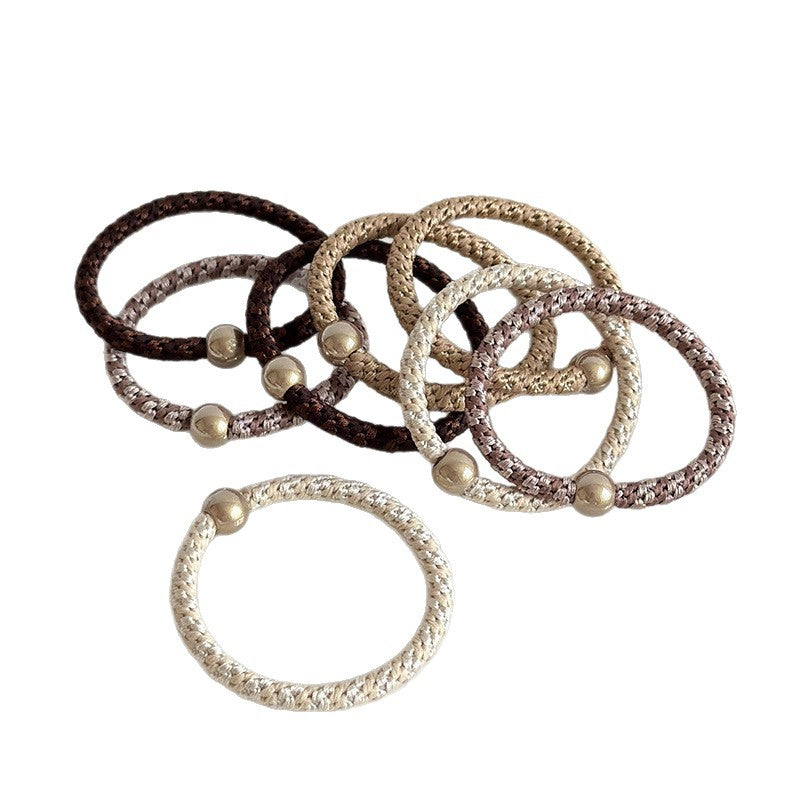 Braided elastic hair ties with bead details in neutral and multicolor shades