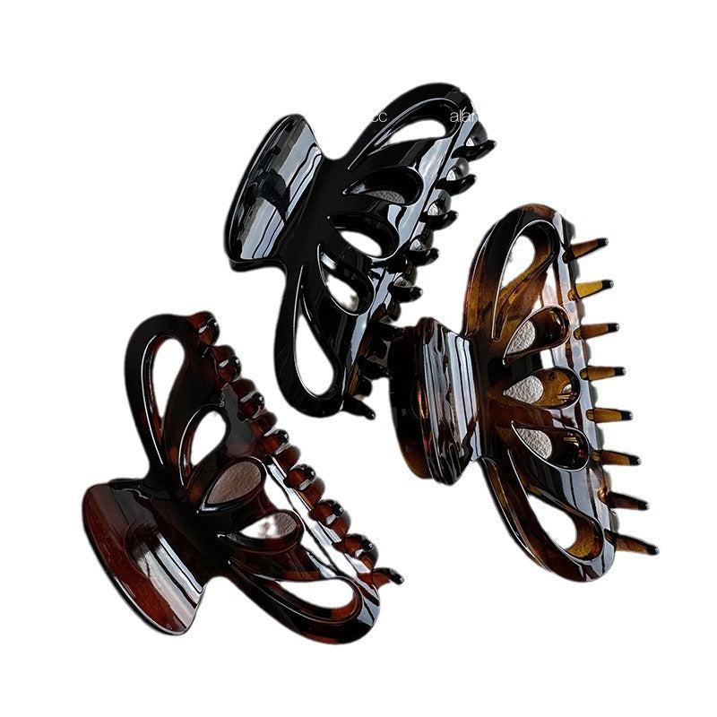 Four-color resin claw hair clip collection with white, brown, red brown, and black options