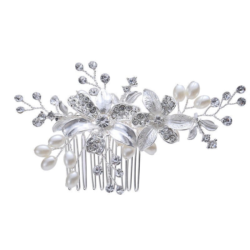 Floral hair comb with silver-colored alloy branches, white faux pearls, and rhinestone details