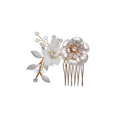 Reverse view of floral bridal comb showing its metal teeth and ceramic blossoms