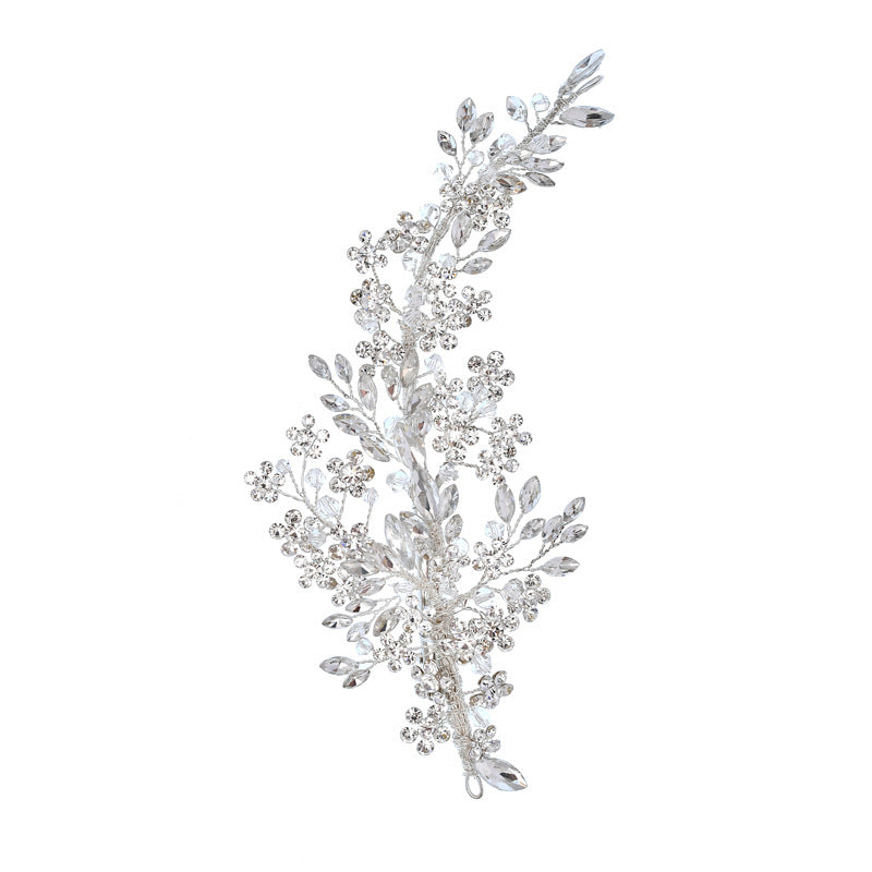 Silver rhinestone bridal hair vine with leaf and floral details, left-side view