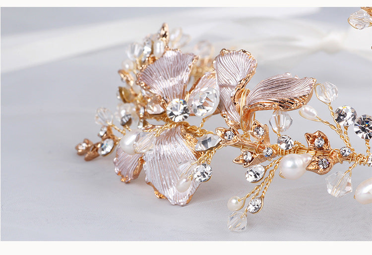 Close-up of gold floral hair vine with pearls and rhinestones