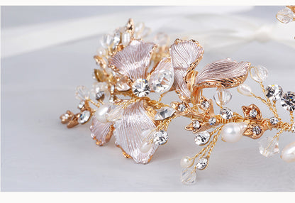 Close-up of gold floral hair vine with pearls and rhinestones