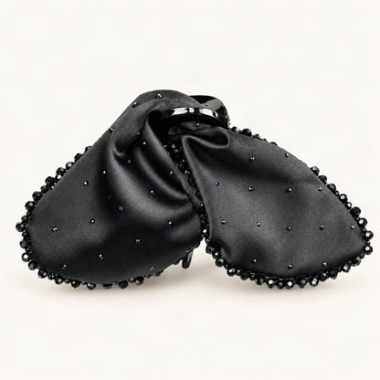 Close-up of black satin bow claw clip with dark rhinestone trim [FITINY Hair]
