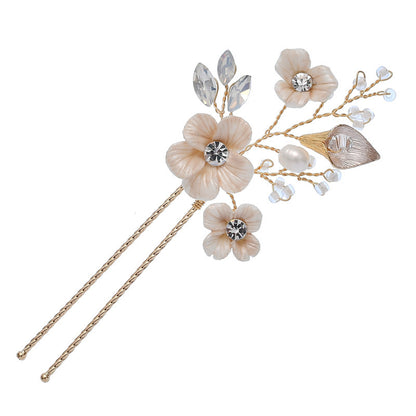 Floral hair pins decorated with crystal accents and pearl detail