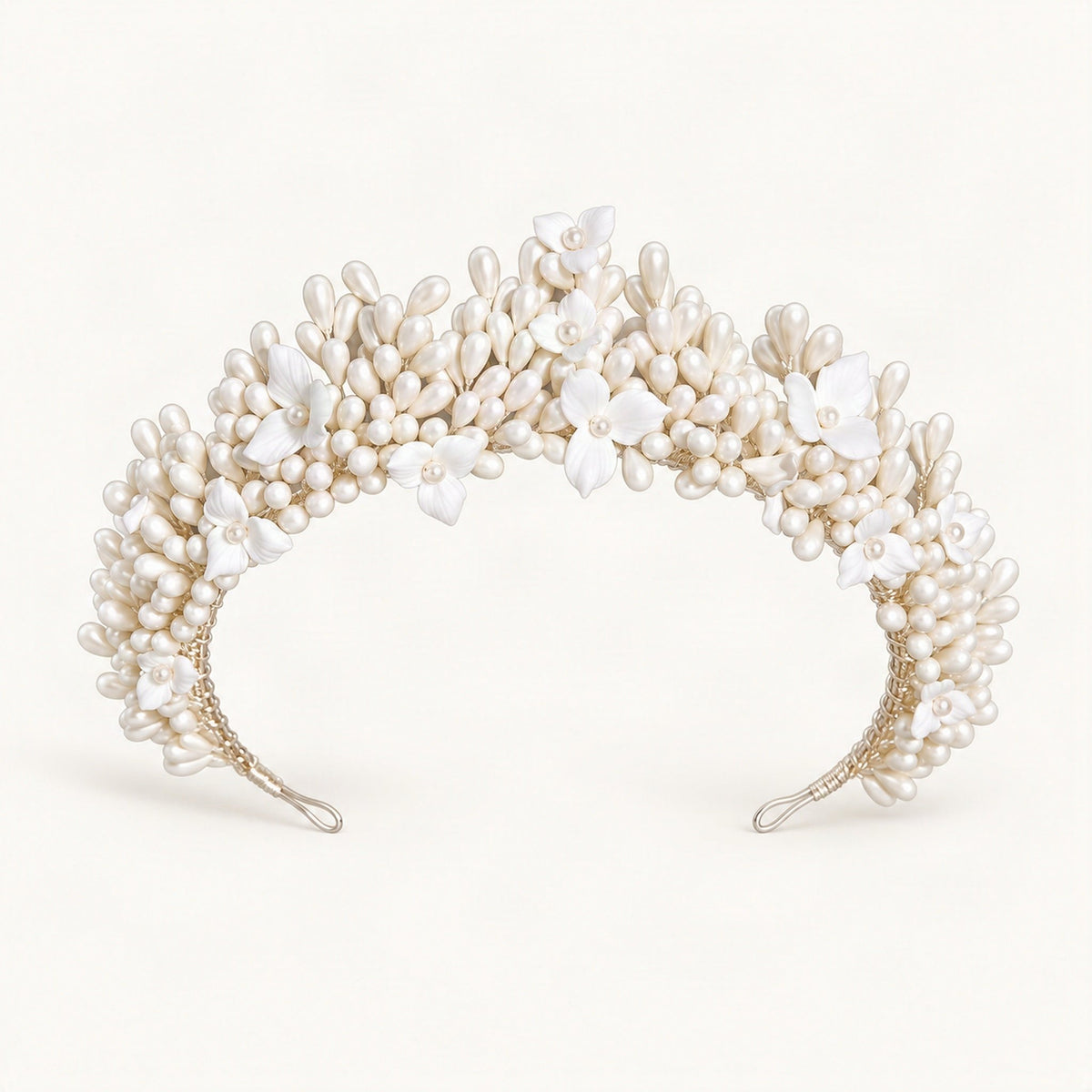 Floral bridal crown with faux pearl details arranged in a curved headpiece [FITINY Hair]
