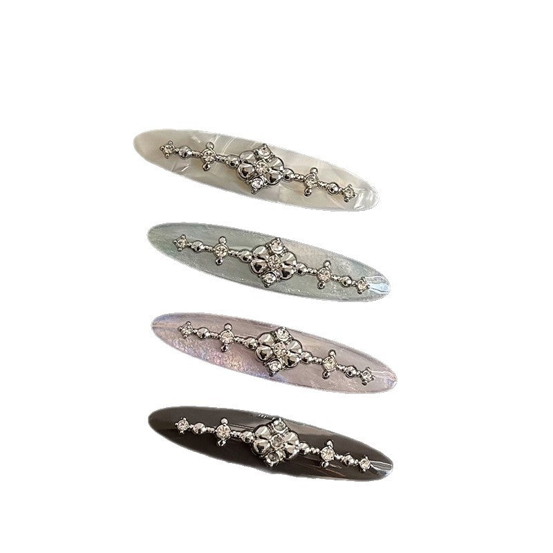 Acetate side hair clip with decorative metal detail in assorted colors