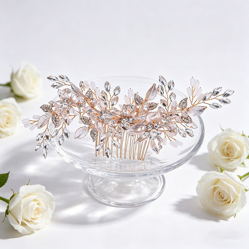 Floral crystal hair comb shown on a glass stand