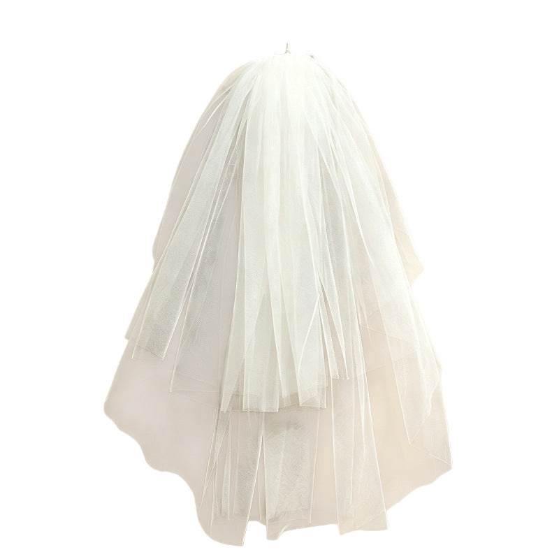 White layered tulle veil displayed from the back