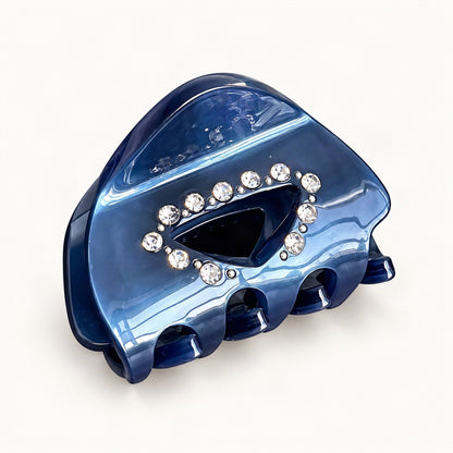 Compact blue cellulose acetate claw clip shown in a decorative hair accessory view [FITINY Hair]