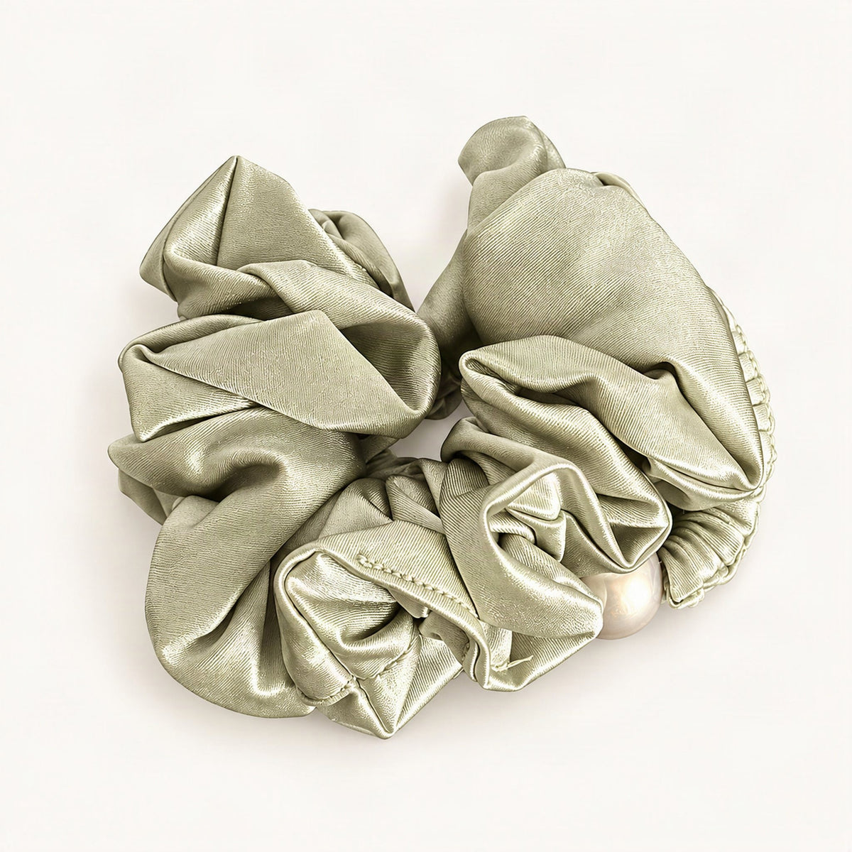 Sage green velvet fabric scrunchie shown against a plain background [FITINY Hair]