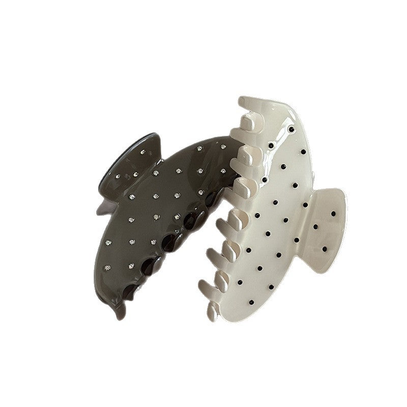 Cream and dark green cellulose acetate claw clips with polka dots and rhinestone accents