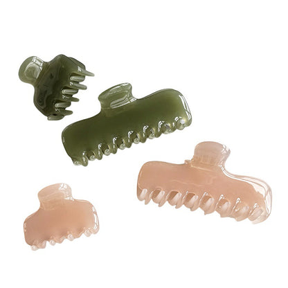 Pink and green glossy cellulose acetate claw clips shown from multiple angles