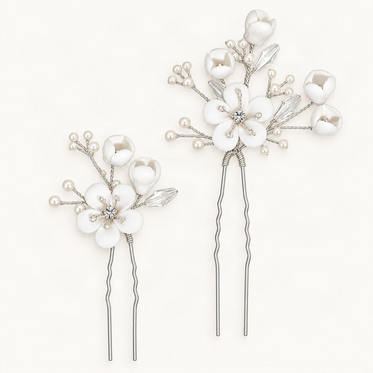 White ceramic flower hair pins with faux pearls and crystal accents on blue [FITINY Hair]