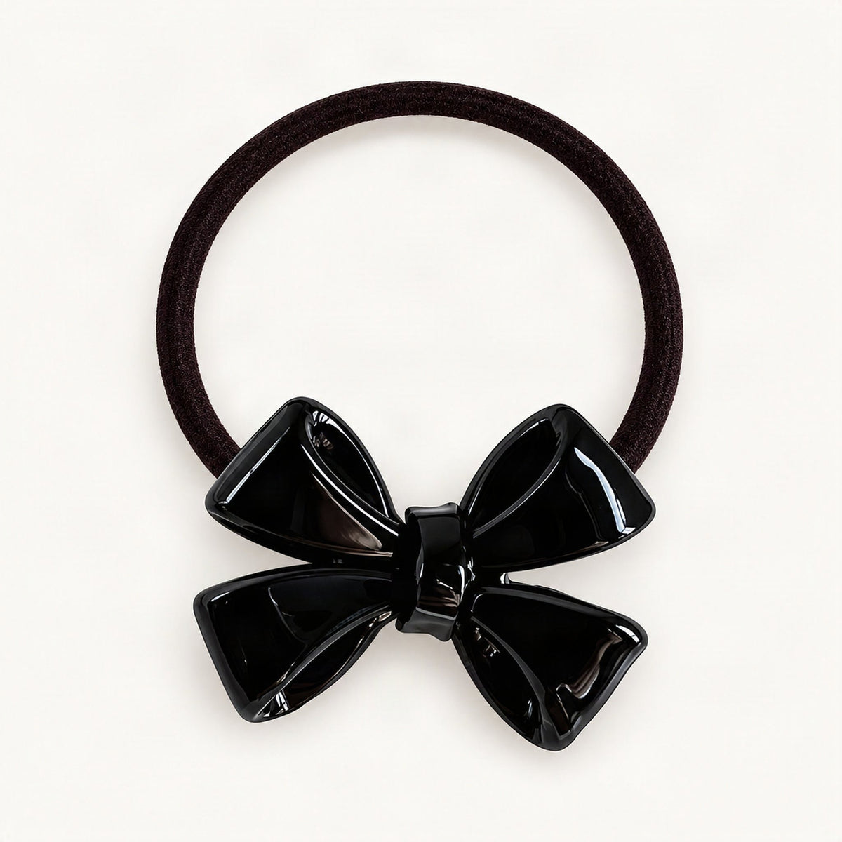 Black dimensional bow hair tie on a clean background [FITINY Hair]