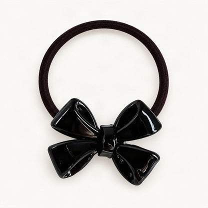 Black dimensional bow hair tie on a clean background [FITINY Hair]