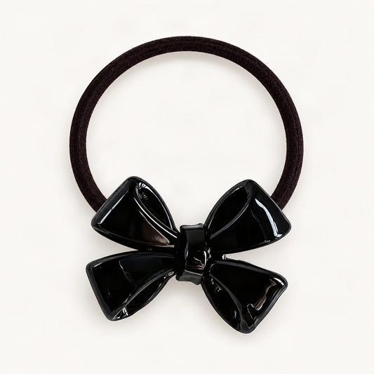 Black dimensional bow hair tie on a clean background [FITINY Hair]