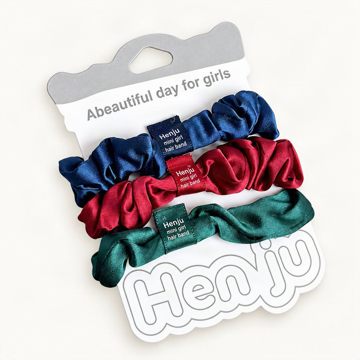 Muted multicolor satin scrunchies shown as a three-pack [FITINY Hair]