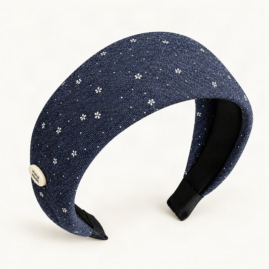 Navy fabric headband with tiny white flowers shown from the front [FITINY Hair]