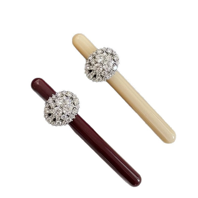 Cream cellulose acetate side hair clip with rhinestone cluster