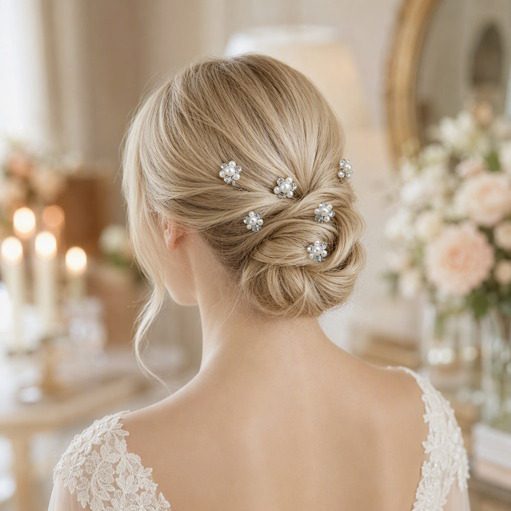 Floral pearl hair pins styled in a low wedding bun