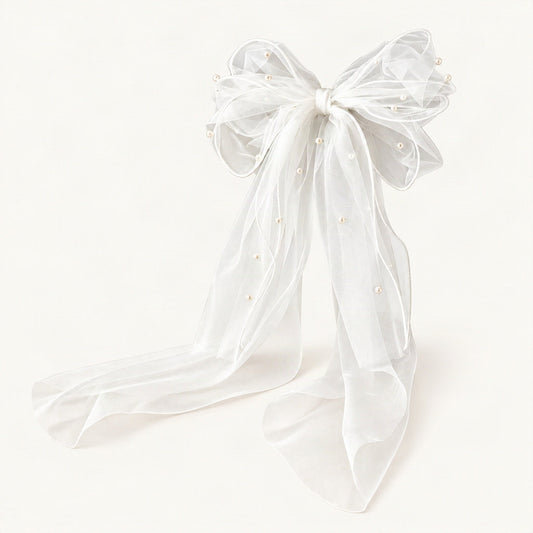 White sheer bow hair clip with pearl accents and long mesh tails on a neutral background [FITINY Hair]