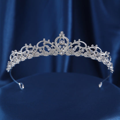 Silver crown headband displayed against a clean white background