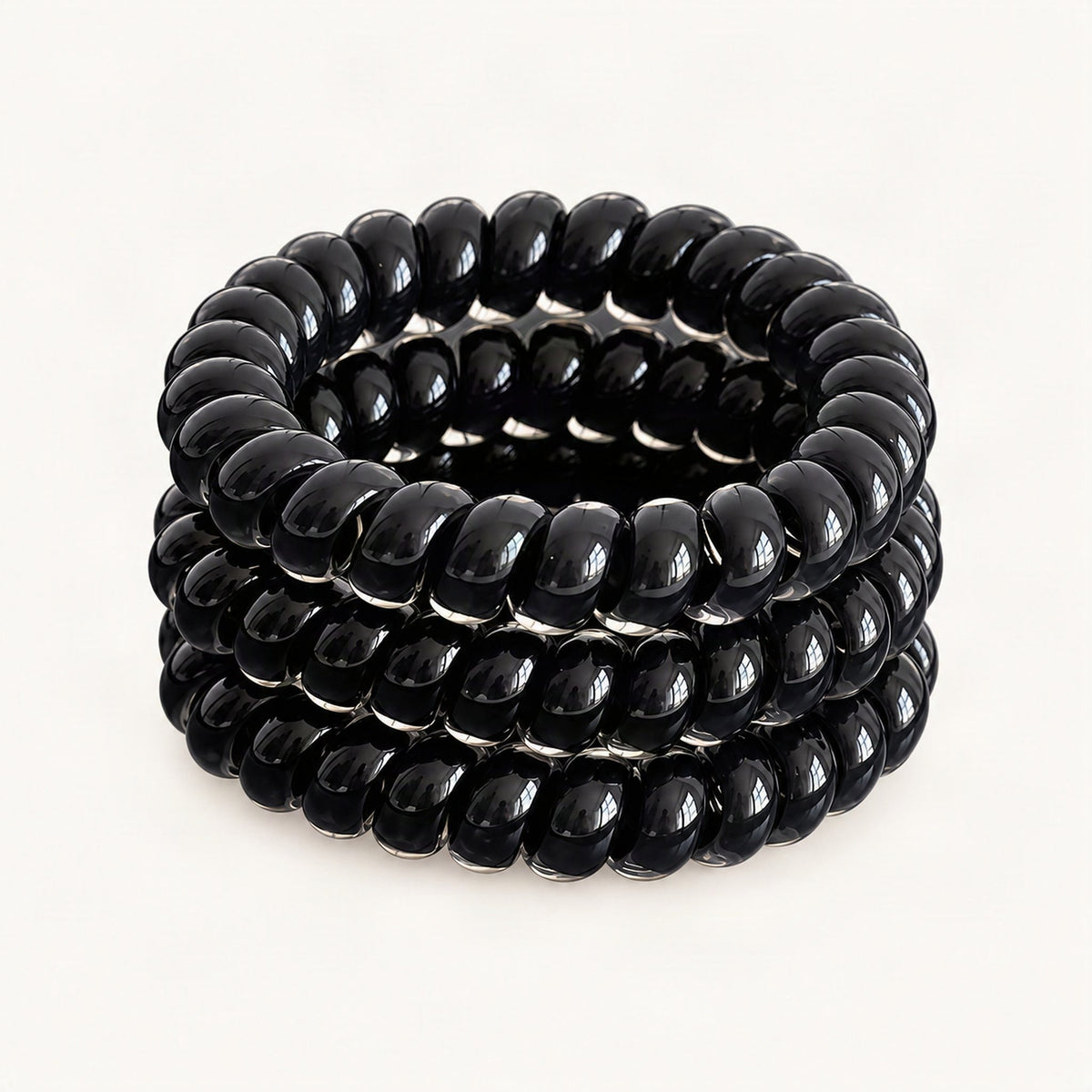 Three black elastic hair ties arranged together [FITINY Hair]