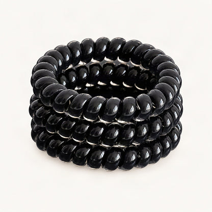 Three black elastic hair ties arranged together [FITINY Hair]