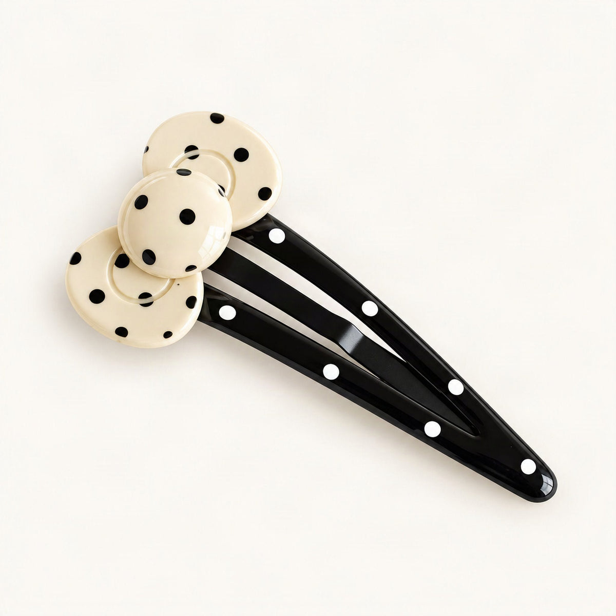 Cream and black polka dot hair clip showing the acetate finish [FITINY Hair]