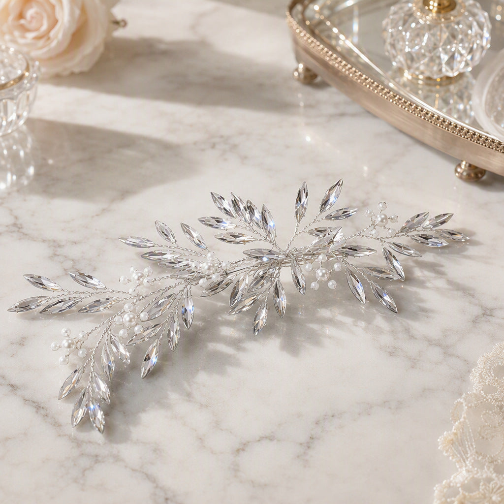 Silver botanical bridal hair accessory displayed on a surface