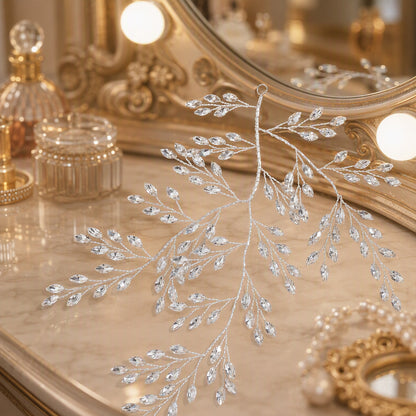 Branching rhinestone leaf hair vine displayed against an ornate vanity