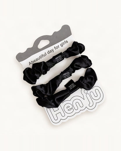 Three black satin scrunchies arranged as a color assortment [FITINY Hair]