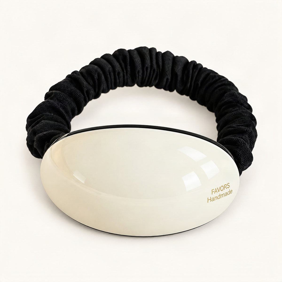 White oval hair tie shown against a plain background [FITINY Hair]