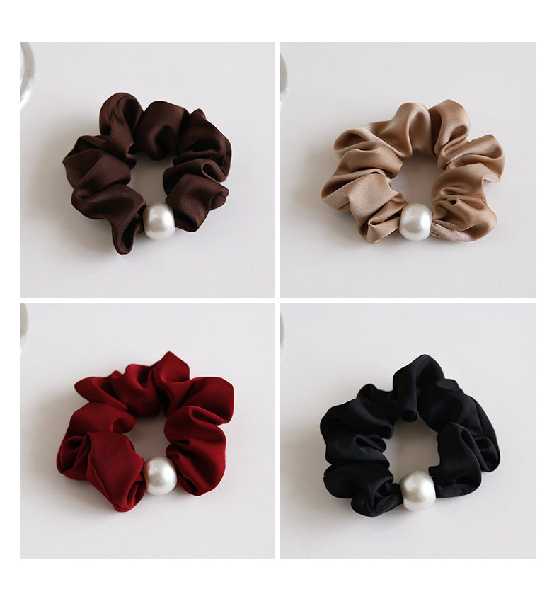 Chocolate satin pearl scrunchie on white background