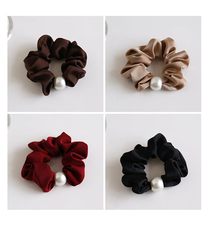 Chocolate satin pearl scrunchie on white background