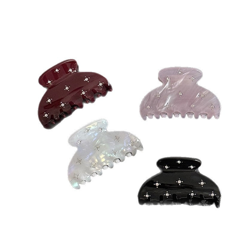 Acetate claw clip with rhinestone accents in black, mermaid, burgundy, and purple