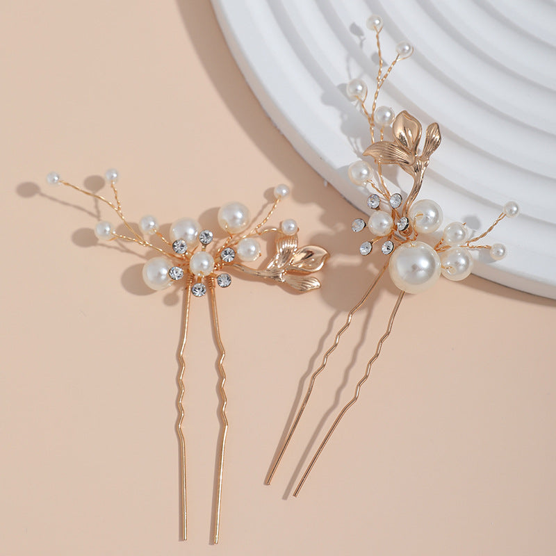 Hair comb and two coordinated pins displayed together