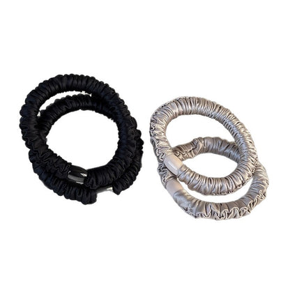 Compact tub of high-elasticity hair ties shown with assorted colors