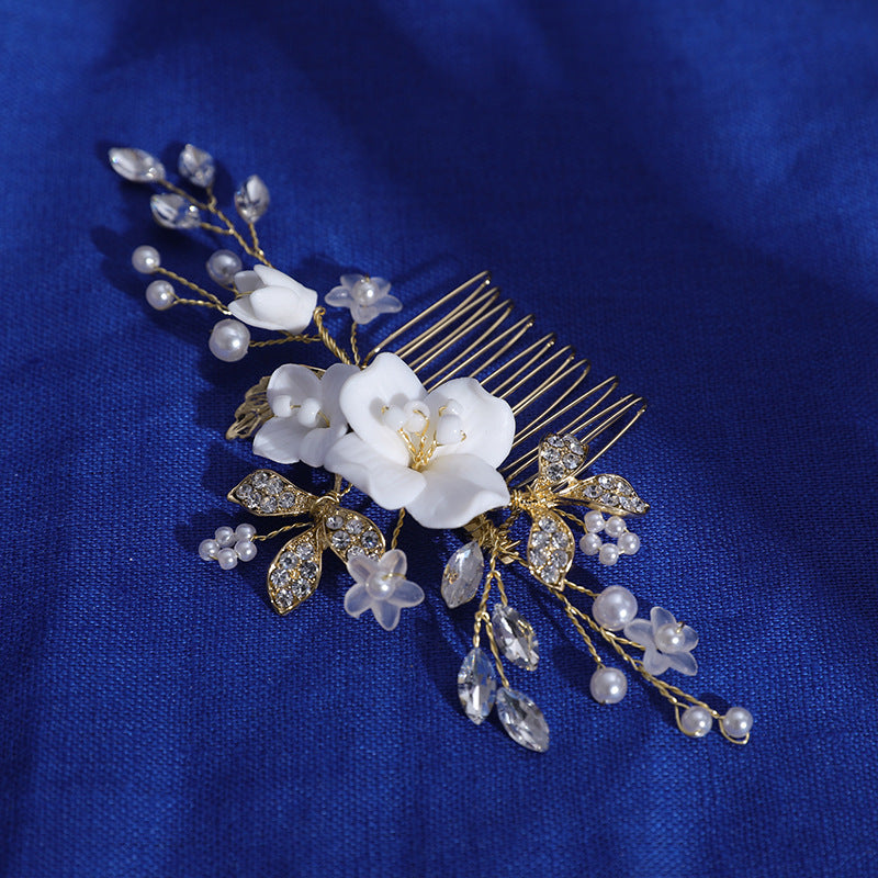 Angled view of comb teeth and floral embellishments