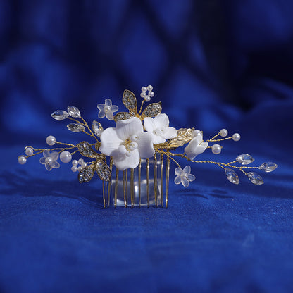 Bridal hair comb arranged on blue fabric