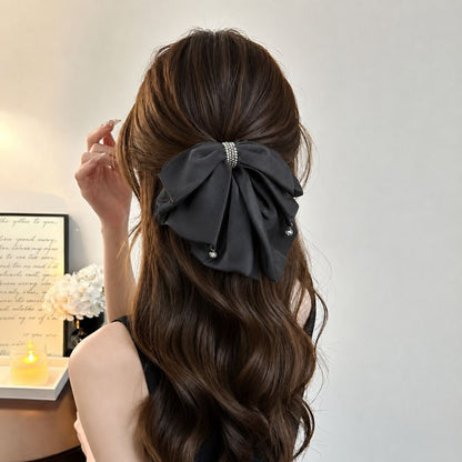 Bow hair clip styled in long hair