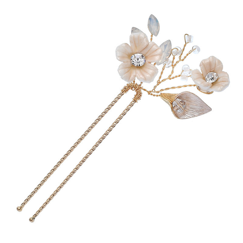 Handmade gold hair pins with pale floral and crystal details