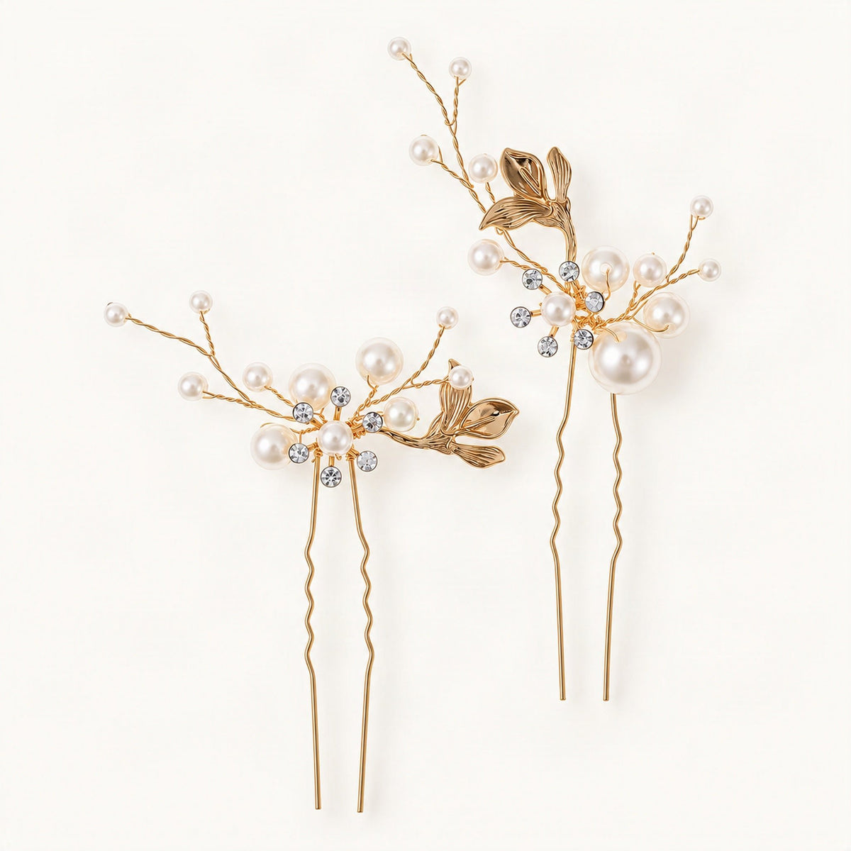 Two matching gold-tone hair pins decorated with faux pearls and leaf details [FITINY Hair]