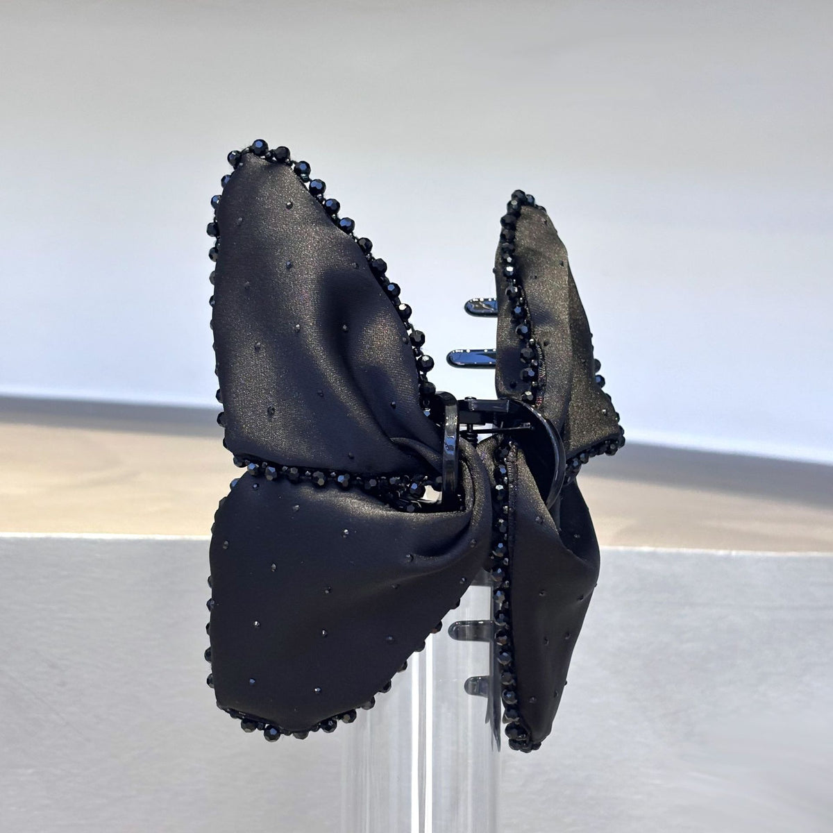 Side angle showing the bow detail and claw clip body